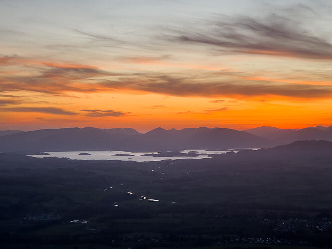 Orange sky with wispy clouds, just after sunset over Loch Lomond