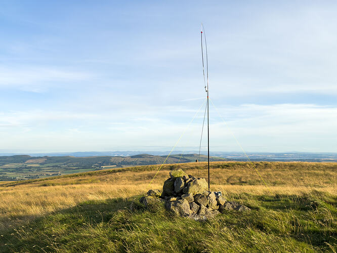 Slim G antenna rigged beside summit cairn