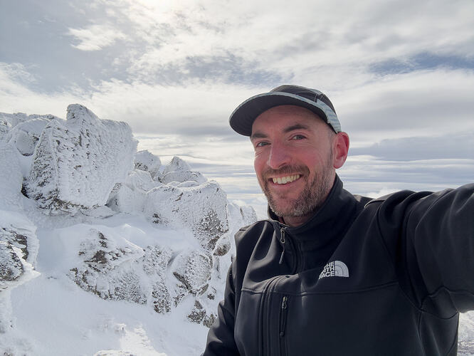 Selfie among the rime-crusted rocks near the summit
