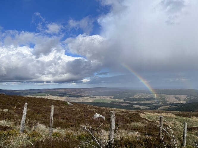 Rainbow as rain heads over Kielder
