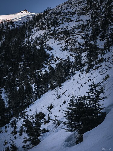 Putting on crampons for the icy ascent.