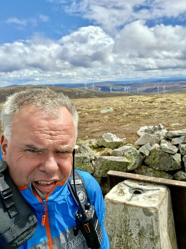 Fraser enjoying the cairn on Corryhabbie