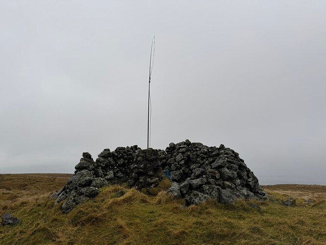 Summit shelter at Stronend with Slim G antenna in the trig point