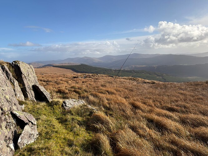 The slant of the mast was a result of a delicate balance between antenna tension, wind direction, and surface which was too soft for proper guying.