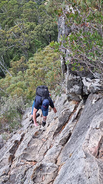 Steep rock face climb