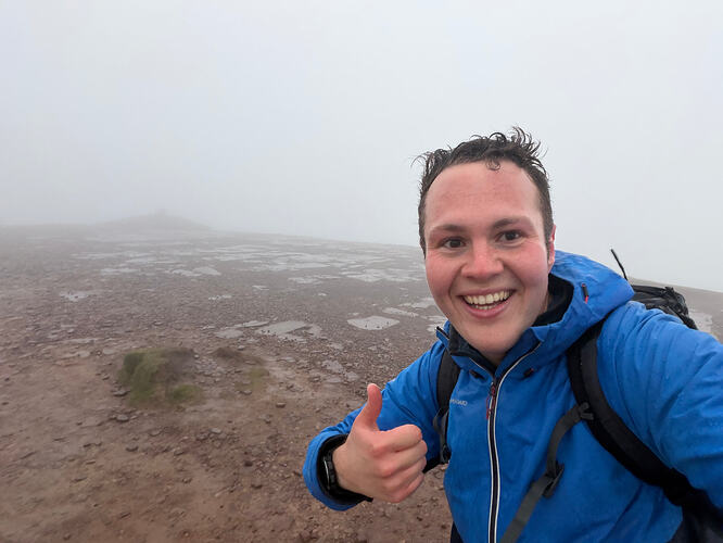 On the summit of GW/SW-001. The weather dramatically turned at the last minute, drenching me from head to toe