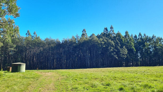Large clearing and water tank for firefighting.