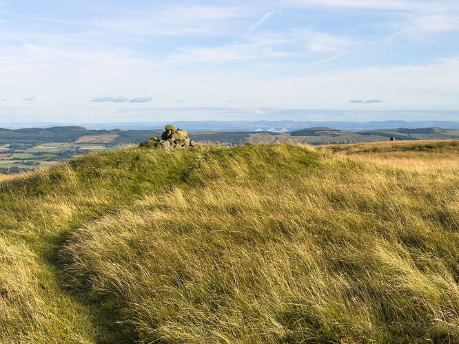 Summit cairn with trig point and Forth Bridges in background