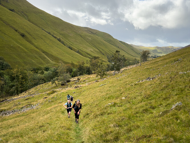 Runners ascending out of Glen Tilt towards Carn a’ Chlamain
