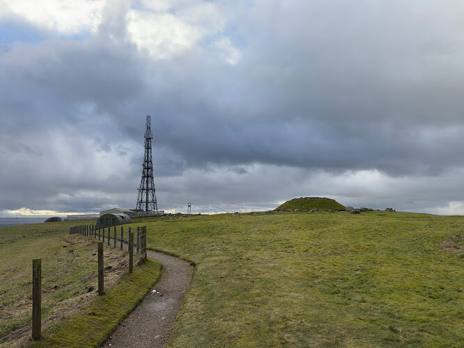 View of Cairnpapple Hill, showing the cairn and the nearby radio mast.