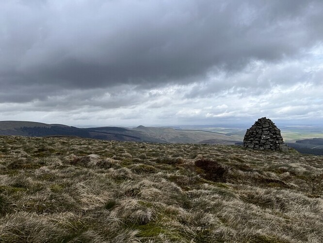 Greatmoor Hill cairn and approaching rain