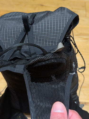 Ripped shoulder strap on running pack.