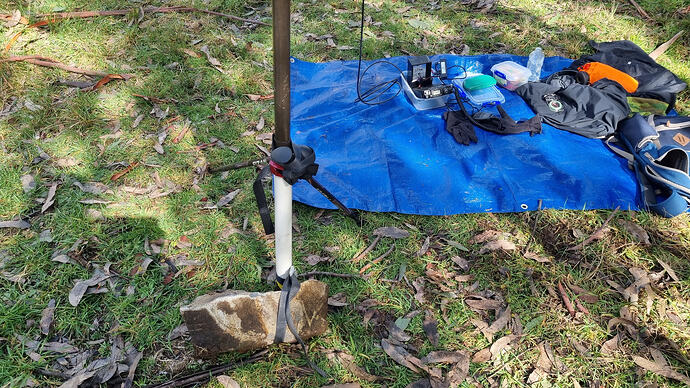 6m pole support - hike poles and a rock.